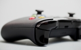 <p>New "impulse triggers" feature haptic feedback, and the shoulder buttons are nearly continuous for easier transition from trigger to bumper.
